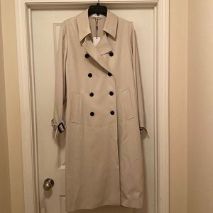 Raincoat, pleated back. Stone/cream colored. New - hasn’t been worn.